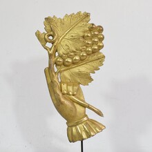 Giltwood hand holding a branch of grapes, Italy circa 1750