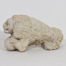 Carved stone lion holding a ball, Italy circa 1650-1750