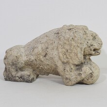 Carved stone lion holding a ball, Italy circa 1650-1750