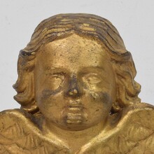 Baroque carved giltwood angel head on wings, Italy circa 1750