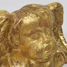 Baroque carved giltwood angel head on wings, Italy circa 1750