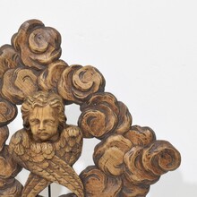 Carved oak winged angel head in clouds ornament, France circa 1800-1850