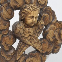 Carved oak winged angel head in clouds ornament, France circa 1800-1850