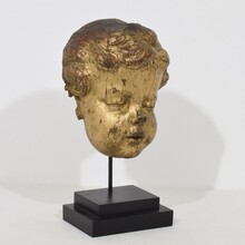 Carved giltwood baroque angel head, France circa 1650-1750