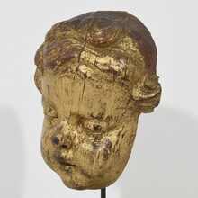 Carved giltwood baroque angel head, France circa 1650-1750