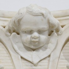 Carved white marble capital with angel head, France circa 1750