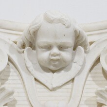 Carved white marble capital with angel head, France circa 1750