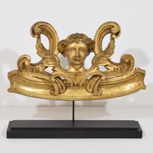 Carved giltwood ornament with winged angel head, France circa 1900