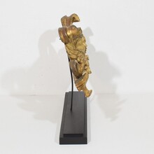 Carved giltwood ornament with winged angel head, France circa 1900