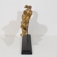 Carved giltwood ornament with winged angel head, France circa 1900