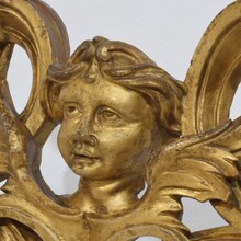 Carved giltwood ornament with winged angel head, France circa 1900