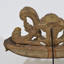 Carved giltwood ornament with winged angel head, France circa 1900