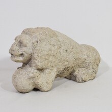 Carved stone lion holding a ball, Italy circa 1650-1750