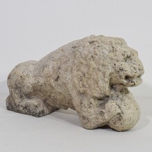 Carved stone lion holding a ball, Italy circa 1650-1750