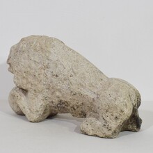 Carved stone lion holding a ball, Italy circa 1650-1750