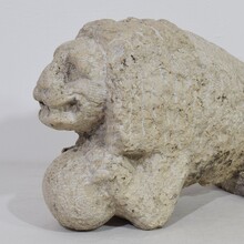 Carved stone lion holding a ball, Italy circa 1650-1750