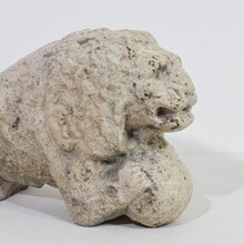 Carved stone lion holding a ball, Italy circa 1650-1750