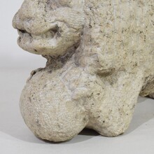 Carved stone lion holding a ball, Italy circa 1650-1750