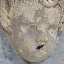 Carved stone cherub fountain head on marble panel, Italy circa 1650-1750