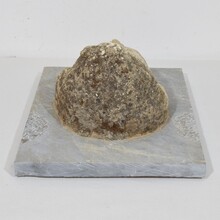 Carved stone cherub fountain head on marble panel, Italy circa 1650-1750