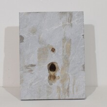 Carved stone cherub fountain head on marble panel, Italy circa 1650-1750