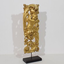 Large hand carved giltwood baroque curl ornament with angel, Italy circa 1750