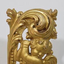 Large hand carved giltwood baroque curl ornament with angel, Italy circa 1750