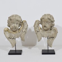 Pair carved wooden winged angel head ornaments, Italy circa 1650-1750