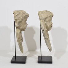 Pair carved wooden winged angel head ornaments, Italy circa 1650-1750