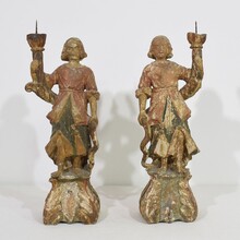 Pair baroque angel figures with candleholders, Italy circa 1650-1700