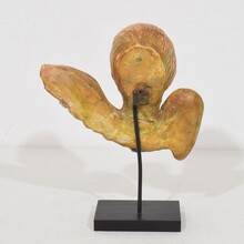 Small baroque carved giltwood angel head on wings, France circa 1750