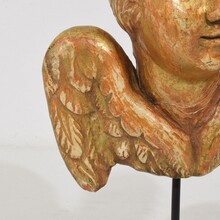Small baroque carved giltwood angel head on wings, France circa 1750