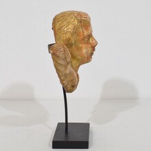 Small baroque carved giltwood angelhead on wings, France circa 1750