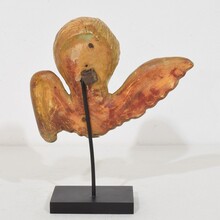 Small baroque carved giltwood angelhead on wings, France circa 1750