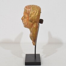 Small baroque carved giltwood angelhead on wings, France circa 1750