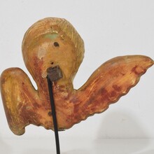 Small baroque carved giltwood angelhead on wings, France circa 1750
