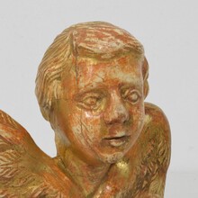 Small baroque carved giltwood angelhead on wings, France circa 1750