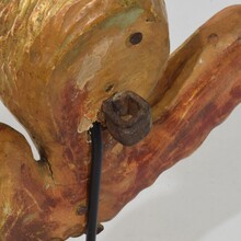 Small baroque carved giltwood angelhead on wings, France circa 1750