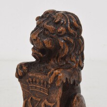 Small hand carved lion sculpture with coat of arms, France circa 1650-1750
