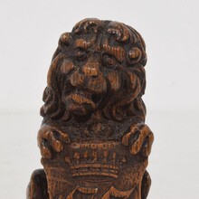Small hand carved lion sculpture with coat of arms, France circa 1650-1750