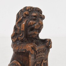 Small hand carved lion sculpture with coat of arms, France circa 1650-1750