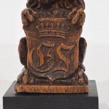 Small hand carved lion sculpture with coat of arms, France circa 1650-1750